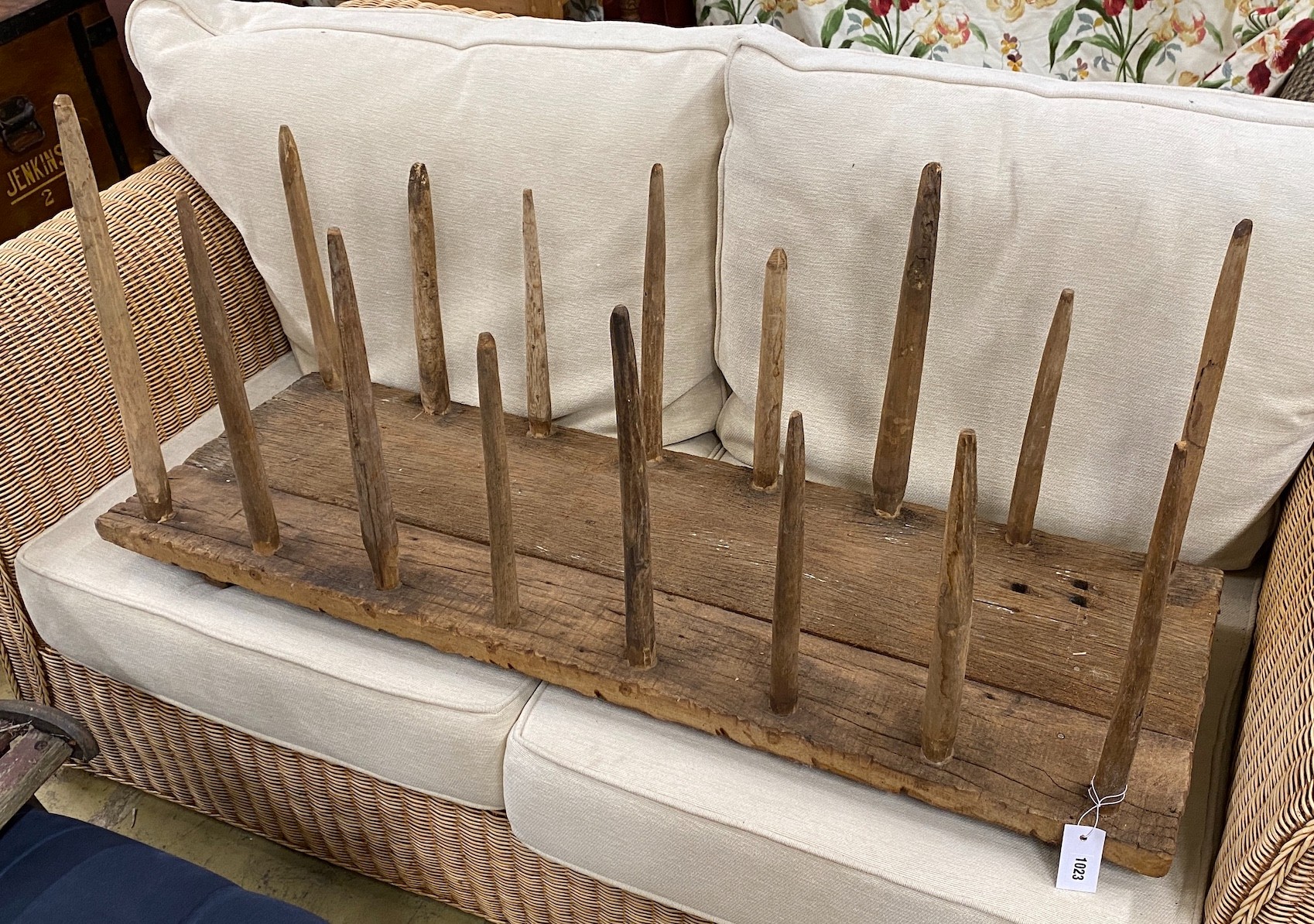 A primitive oak and fruitwood boot rack, width 120cm, depth 40cm, height 57cm